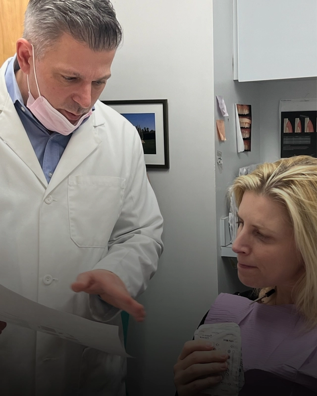 Dr. Psaltis discussing treatment options with a patient